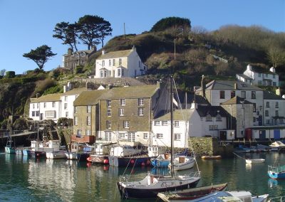 very large polperro harbour and boats